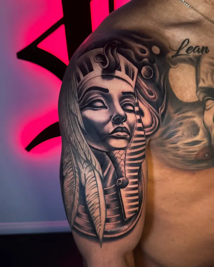 Black and grey tattoo by Dre: egyptian queen, shoulder
